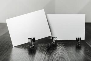 Blank cards clipped on a wooden surface waiting for messages or designs to be added during a creative session photo