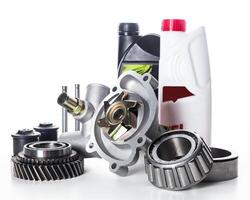 Essential automotive parts and fluids are arranged for maintenance tasks in a workshop setting photo