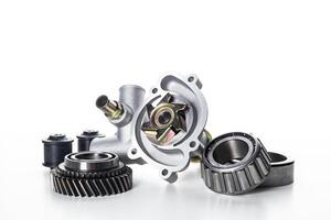 Various mechanical components arranged on a white background highlighting their intricate designs and features photo