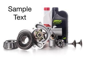 Assorted automotive parts and fluids arranged artistically on a light background photo
