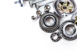 Various Mechanical Parts Arranged Neatly on a White Surface for Assembly and Repair Work photo