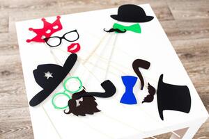 Fun party props arranged on a table for a lively photo booth at a celebration