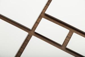 Creative layout of blank cards on a wooden surface with geometric arrangement inspiring artistic design concepts photo