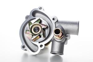 Water pump assembly displayed on a white background highlighting its design and functionality features in automotive applications photo