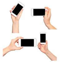 Hands holding multiple smartphones in various orientations showcasing interaction and modern communication photo