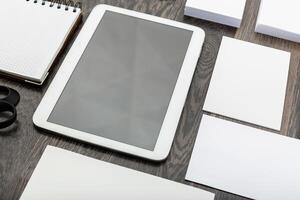 Blank branding elements, mock up with digital tablet, top view photo