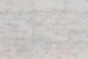 Textured concrete surface with subtle variations in color and pattern ideal for background design and architectural projects photo