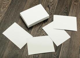 Blank cards and a stack on a wooden surface ready for creative projects or personalized messages photo