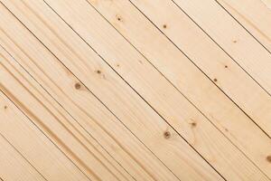 Light wooden floorboards arranged diagonally in a spacious area with natural texture and grain details photo