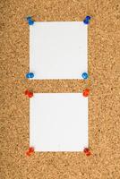 Blank notes pinned on corkboard ready for messages or reminders in a cozy workspace photo