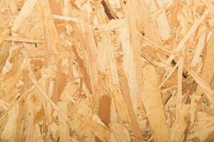 Wood chips spread across the surface in a workshop during daylight hours for crafting and construction projects photo