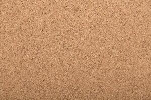Cork board surface showing a simple and natural texture suitable for notes and messages photo