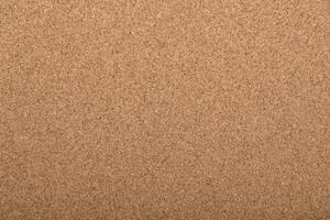 Cork board surface with textured finish suitable for notes and decorations in various settings photo
