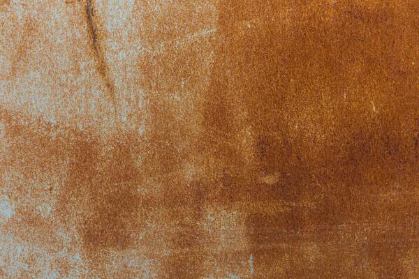 Textured surface with warm brown tones and subtle variations in color and light, resembling natural materials in a simple design