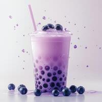 A purple bubble tea with blueberries on top photo