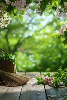 Spring background with flowers and a broom on wooden table photo