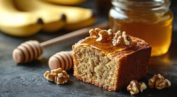 A slice of banana bread with honey and walnuts photo