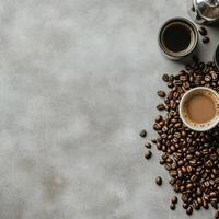 Coffee beans and coffee cups on a gray background photo