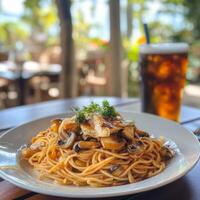Spaghetti with chicken and mushrooms photo