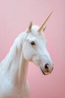 A white unicorn with a long horn on its head photo