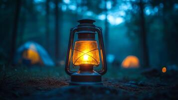 A lantern is lit up in the woods photo