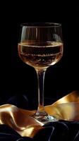 A glass of champagne on a black cloth photo