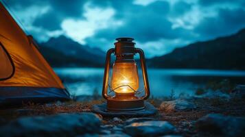 A campfire is lit in front of a tent photo