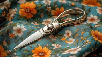 A pair of scissors on a floral fabric photo