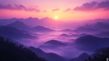 The sun rises over the mountains in this beautiful photo