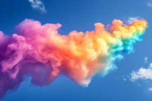 Colorful smoke cloud on blue sky background photo