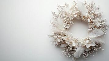 A wreath made of white flowers and feathers photo