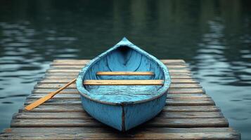 A blue boat sitting on a dock photo