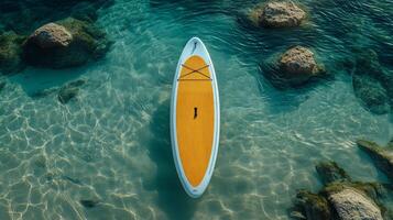 An aerial view of a paddle board in the ocean photo