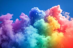 Colorful smoke cloud on blue sky background photo