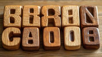 The word brand is spelled out in wooden letters photo