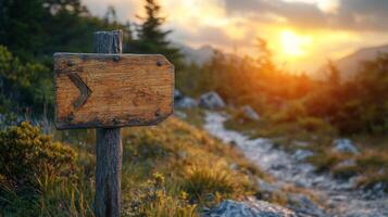 A wooden sign pointing to the right in the mountains photo