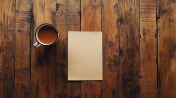 A cup of coffee and a blank paper on a wooden table photo