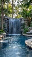 A pool with a waterfall and a waterfall photo