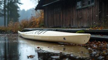 A white kayak on the ground photo