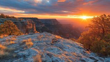 The sun sets over the grand canyon at sunset photo