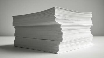 Stack of white paper on a table photo