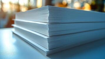 Stack of white paper on a table photo