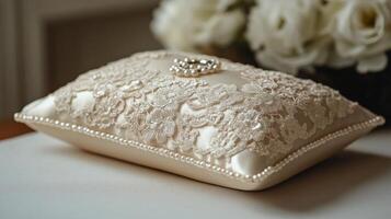 A wedding ring box with pearls and lace photo