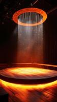 A stage with a large round light and a shower photo