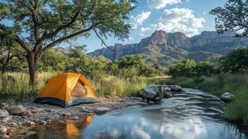 Camping tent in the desert near a river photo