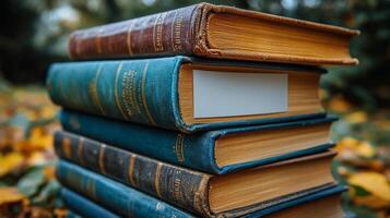 Stack of old books with a blank label photo