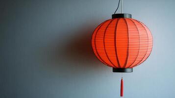 A red lantern hanging on a wall photo