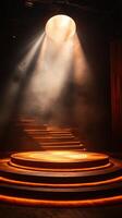 Stage with a spotlight and steps in the dark photo