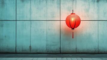A red lantern hanging from a wall photo