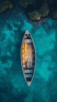 An aerial view of a boat floating in the ocean photo